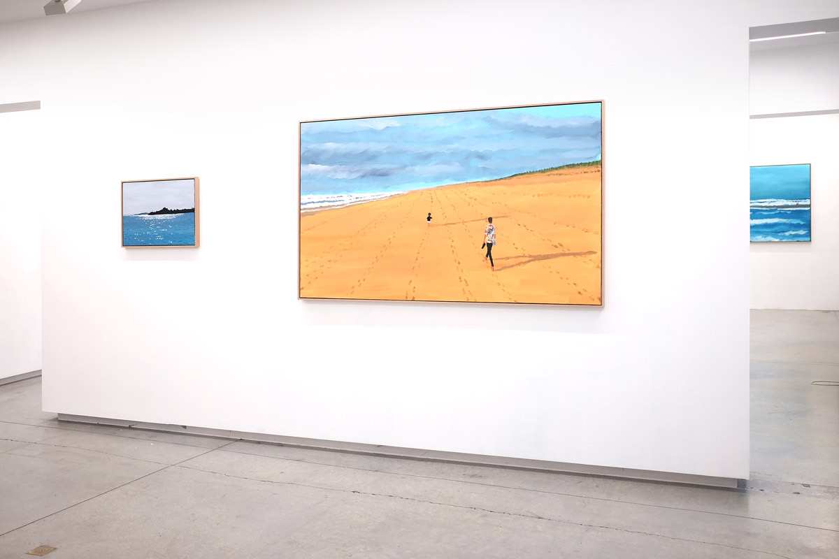 Paintings on display in a gallery